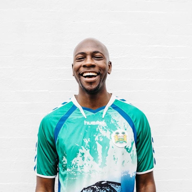 Avery Collins, Lead Design Curator at HarborLinenStudio, reviewing corporate floral arrangements